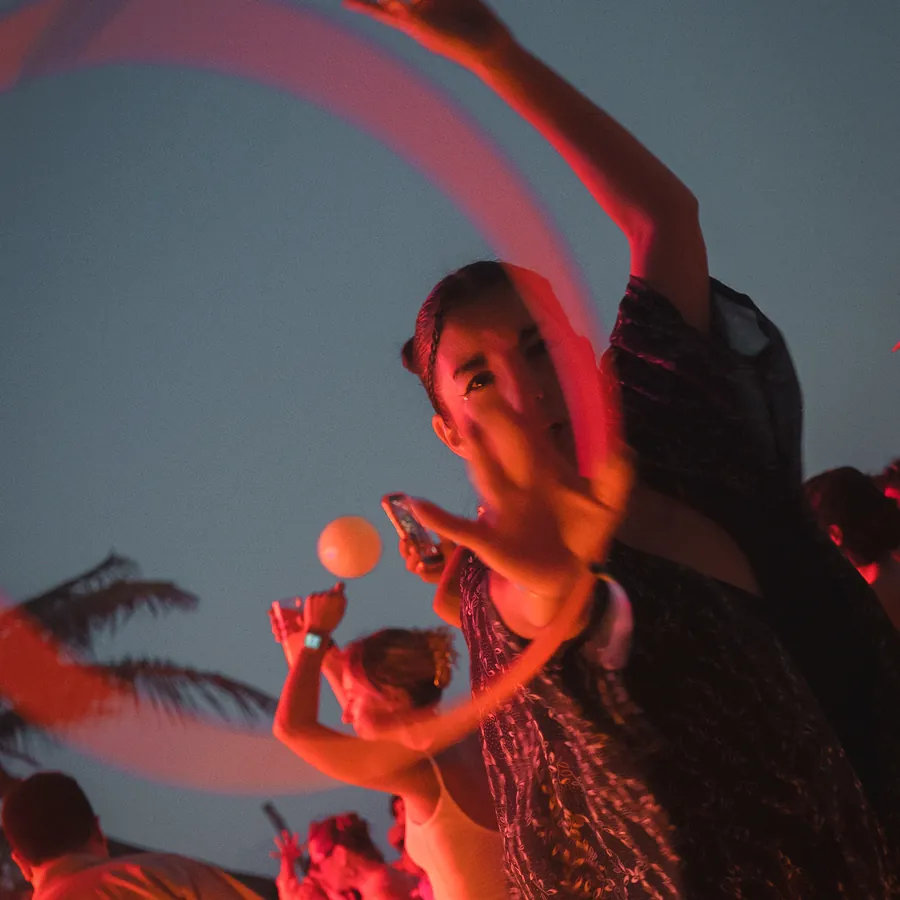 Dancing under red lights after sunset