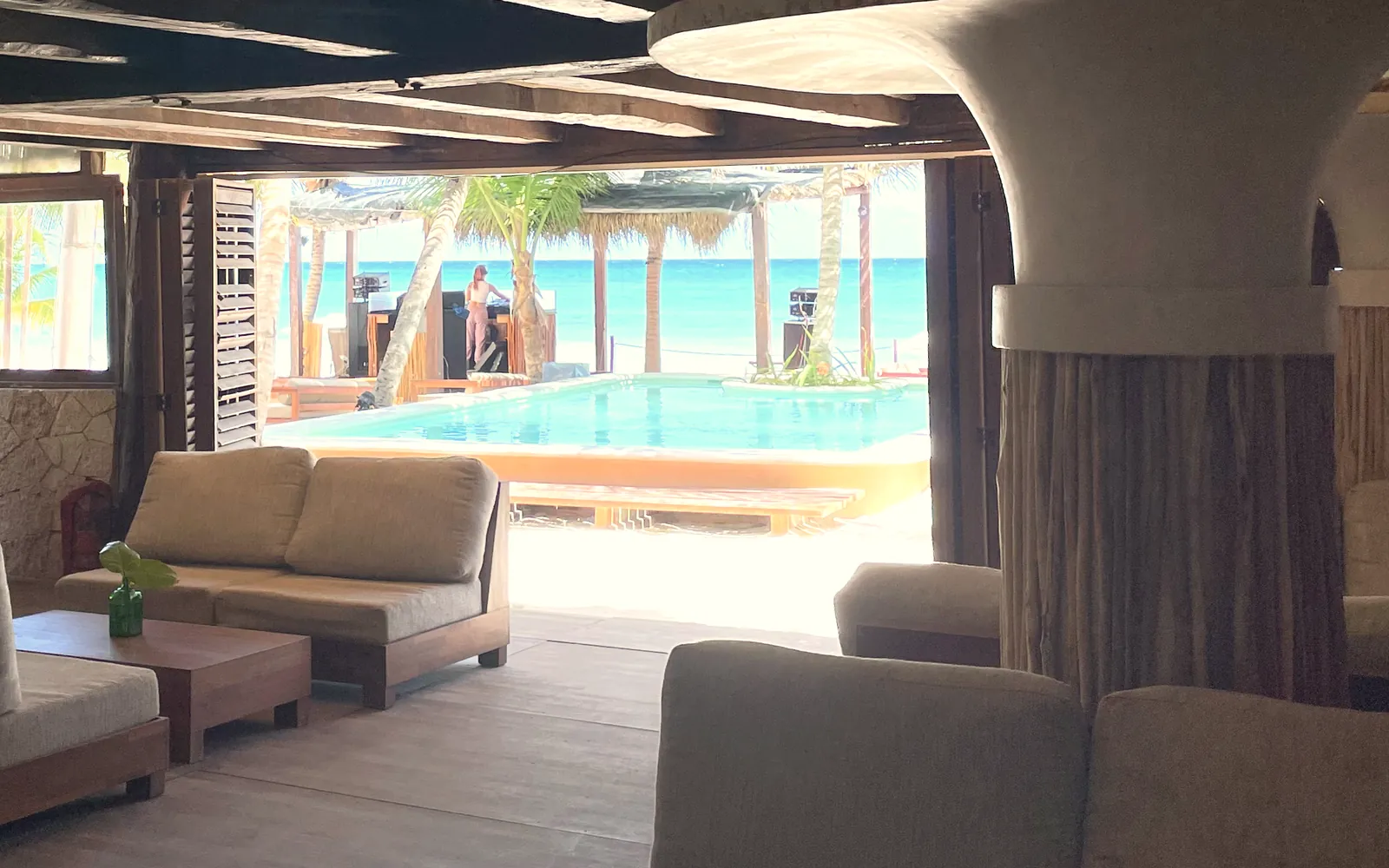 The indoor bar's sofas, looking out to the pool and the sea
